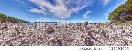 Stone cairns on rocky beach along Adriatic Sea Stone cairns on rocky beach along Adriatic Sea 135293693