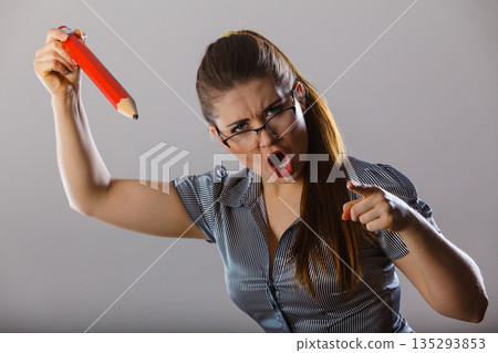 Angry mad bossy businesswoman being furious Angry mad bossy businesswoman being furious 135293853