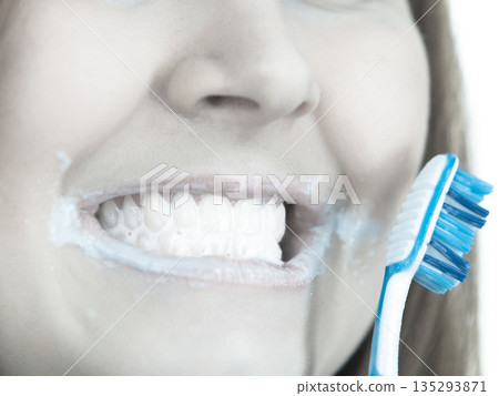 Woman brushing cleaning teeth. Woman brushing cleaning teeth. 135293871