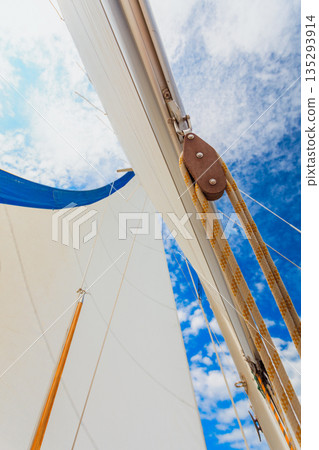 Detailed closeup of sail on sailboat Detailed closeup of sail on sailboat 135293914