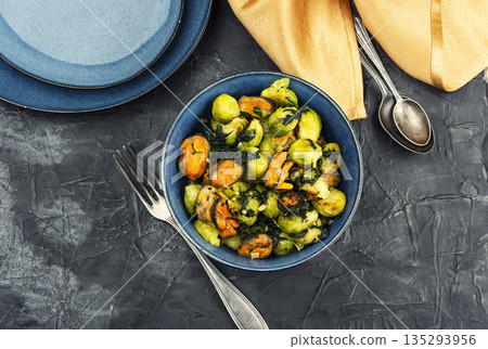 Brussels sprouts with mussels on a plate Brussels sprouts with mussels on a plate 135293956