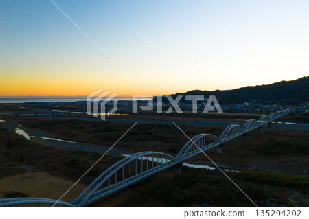 Aerial view of Fuji city and Suruga Bay at dusk Aerial view of Fuji city and Suruga Bay at dusk 135294202