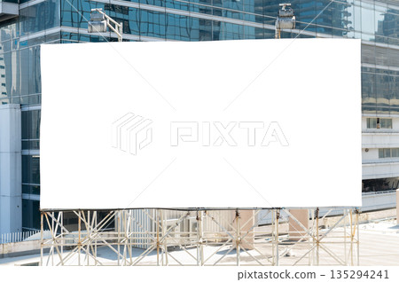 Large blank white billboard mockup in front of modern skyscraper Large blank white billboard mockup in front of modern skyscraper 135294241