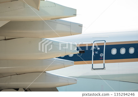 Fuel dump nozzle on the wing of a widebody aircraft Fuel dump nozzle on the wing of a widebody aircraft 135294246
