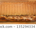 Baked walnut roll crust and filling close up 135294334