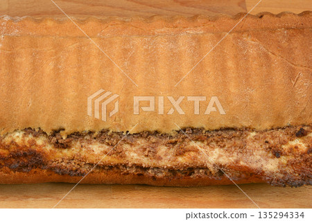 Baked walnut roll crust and filling close up 135294334