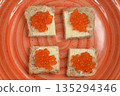 Red trout caviar canapes close up 135294346