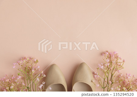 Spring Fashion Flatlay with High Heels and Pink Flowers on Cream Background. Festive Spring Fashion Flatlay 135294520