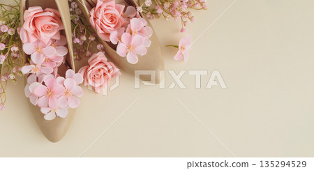 Beige High Heels with Pink Flowers on Cream Background. Festive Spring Fashion Flatlay Beige High Heels with Pink Flowers on Cream Background. Festive Spring Fashion Flatlay 135294529