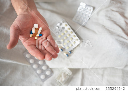Heap of various colorful pills and capsules in hand Heap of various colorful pills and capsules in hand 135294642