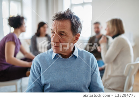 Portrait of older during group therapy. 135294773