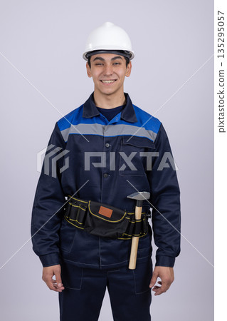 Professional worker with tool belt ready for repair Professional worker with tool belt ready for repair 135295057