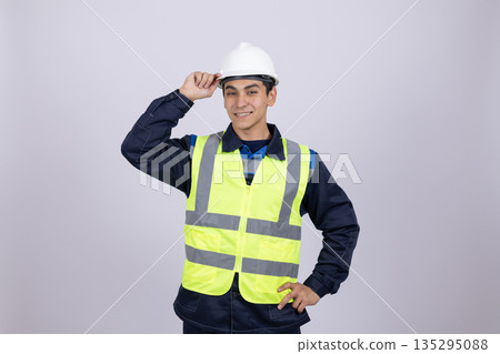 Professional engineer in hard hat looking at camera 135295088
