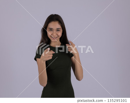 Confident woman pointing at herself with both hands Confident woman pointing at herself with both hands 135295101