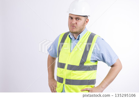 Professional construction worker in yellow reflective vest Professional construction worker in yellow reflective vest 135295106