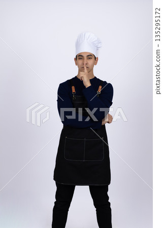 Pensive chef thinking about new recipe in kitchen Pensive chef thinking about new recipe in kitchen 135295172
