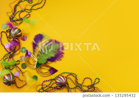Mardi gras carnival mask with colorful feathers beads 135295432