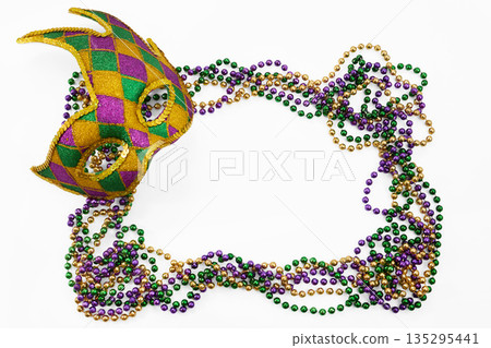 Mardi gras harlequin mask with beads forming frame Mardi gras harlequin mask with beads forming frame 135295441