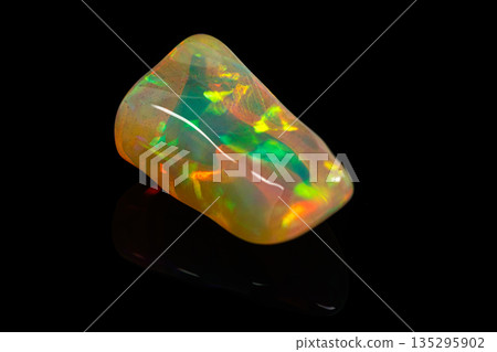 macro mineral stone rare and beautiful opals on a black background macro mineral stone rare and beautiful opals on a black background 135295902