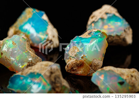 macro mineral stone rare and beautiful opals on a black background macro mineral stone rare and beautiful opals on a black background 135295903