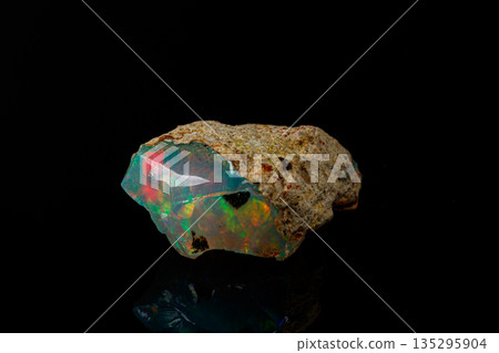 macro mineral stone rare and beautiful opals on a black background macro mineral stone rare and beautiful opals on a black background 135295904