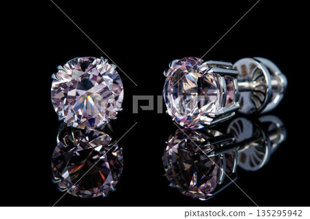 beautiful gold earrings with morganite gemstones on a black background beautiful gold earrings with morganite gemstones on a black background 135295942