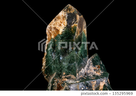 macro Axinite mineral stone on a black background 135295969