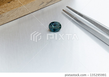 macro mineral faceted stone Sapphire on a gray background 135295991