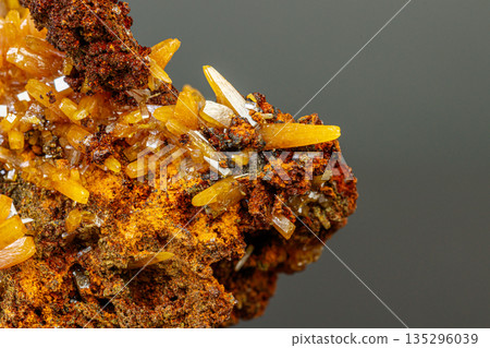 macro mineral Wulfenite stone on a black background 135296039
