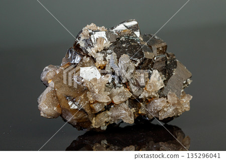 macro mineral cassiterite stone on gray background 135296041
