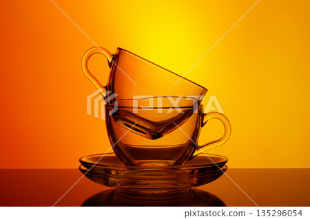 beautiful cups on an orange yellow background 135296054