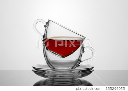 beautiful two cups with tea on a white background 135296055