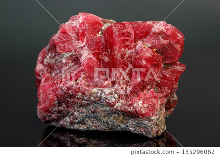macro mineral stone Rhodochrosite on a black background macro mineral stone Rhodochrosite on a black background 135296062