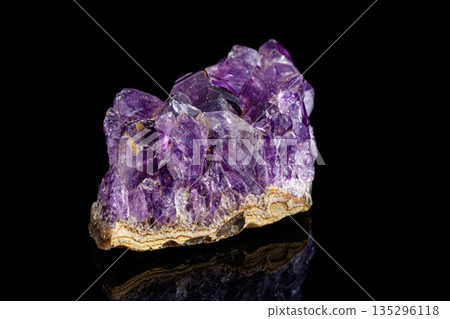 macro mineral stone Amethysts on a black background 135296118
