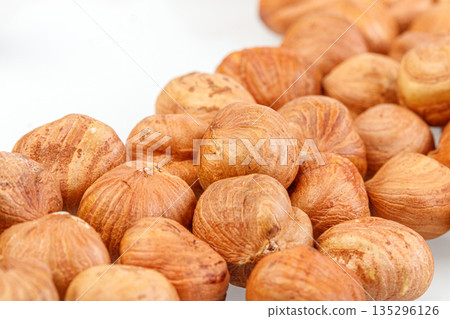 macro hazelnuts nuts on a white background macro hazelnuts nuts on a white background 135296126