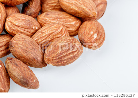 macro almond nuts on a white background macro almond nuts on a white background 135296127