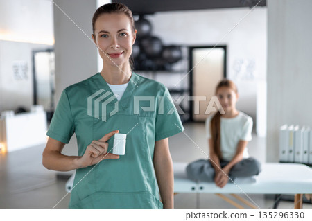 Nurse demonstrating correct medicine packaging with patient Nurse demonstrating correct medicine packaging with patient 135296330