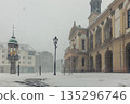 Historic Altermarkt square Magdeburg at heavy snowfall show Rathaus architecture, statues lanterns empty urban space winter storm. Snow covered pavement cold weather dramatic European city atmosphere 135296746