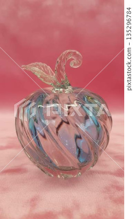 Delicate Glass Apple on Pink Velvet Fabric, Artful Home Decor Object 135296784