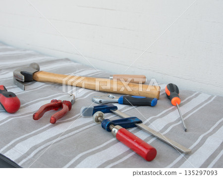 Tools on a table with tablecloth Tools on a table with tablecloth 135297093