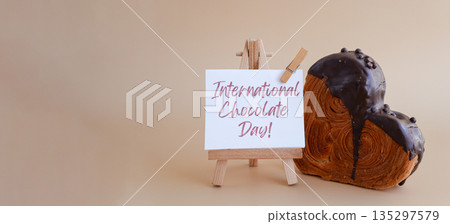 Calendar date 13 September international chocolate day greeting card Delicious fresh croissant topped with colorful flavor Ganache. Creation unique heart shape bakery. Puff pastry holiday love gift Calendar date 13 September international chocolate day greeting card Delicious fresh croissant topped with colorful flavor Ganache. Creation unique heart shape bakery. Puff pastry holiday love gift 135297579