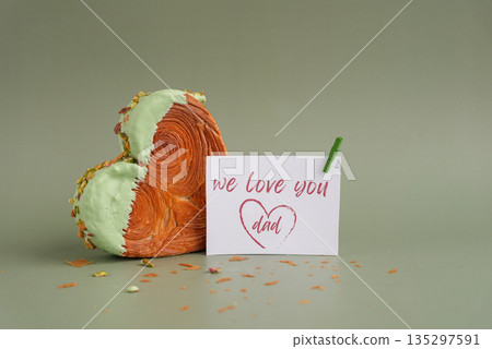FATHER'S day holiday card Delightful and vibrant heartshaped pastry croissant treat, beautifully topped with colorful frosting nut galore. Mock up template copy space. Food experimentation viral 135297591