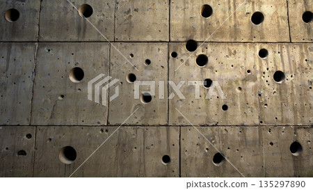 Memories of time engraved with countless bullet holes - a quiet wall of hope jutting out beyond the destruction 135297890