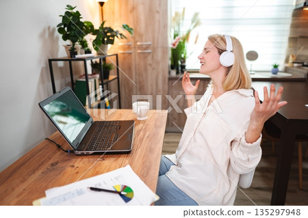 Engaging online conversation brings joy in a cozy workspace Engaging online conversation brings joy in a cozy workspace 135297948