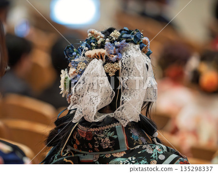 Back view of a woman wearing a beautiful kimono at the Coming of Age Ceremony Back view of a woman wearing a beautiful kimono at the Coming of Age Ceremony 135298337