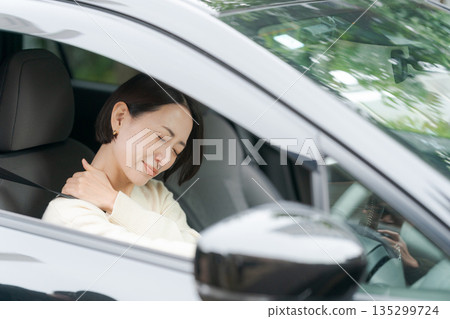 A woman driving a car A woman driving a car 135299724