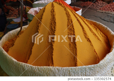 Turmeric powder on bag on shop Turmeric powder on bag on shop 135302574