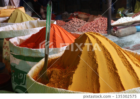 Turmeric powder on bag on shop Turmeric powder on bag on shop 135302575