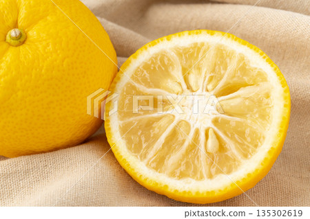 Close-up of sliced yuzu on a cloth Close-up of sliced yuzu on a cloth 135302619