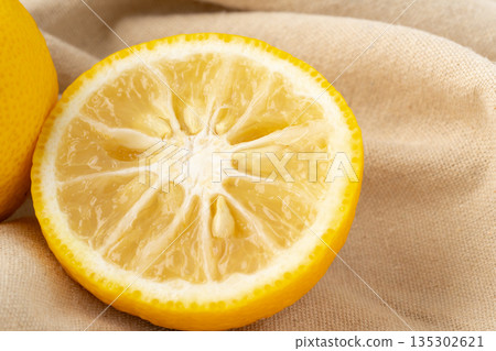 Close-up of sliced yuzu on a cloth 135302621